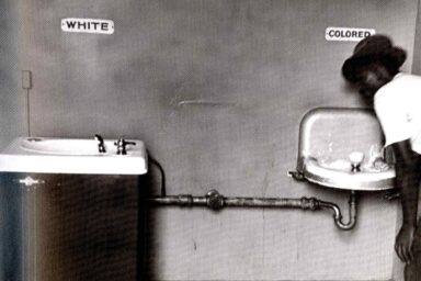 White Votes Matter: Supreme Court Makes Jim Crow Great Again man drinking, segregated water fountain, Wilmington, NC