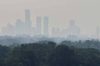Republicans Are Trying To Give Big Oil Immunity for Causing Climate Chaos Smoke, Mississauga, Canada, skyline